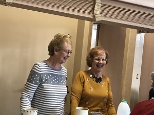 Ladies serving at coffee morning